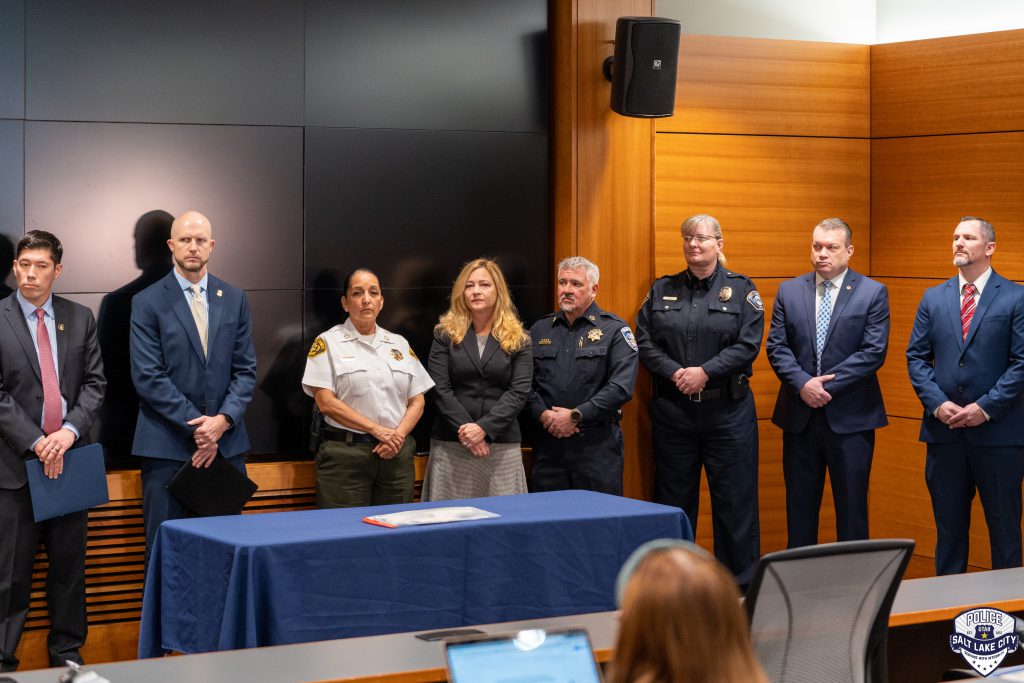 A group of law enforcement officials standing together during a press conference.
