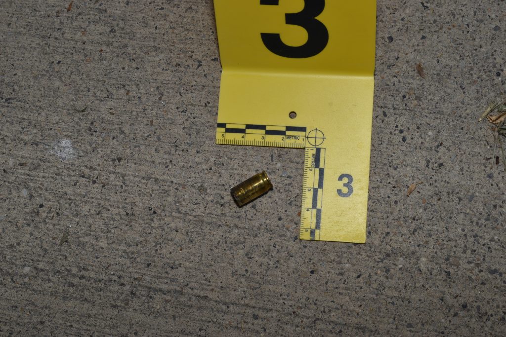 1 - A spent shell casing and an SLCPD evidence mark document a shooting from July 6, 2023 (Photo credit: Salt Lake City Police Department).