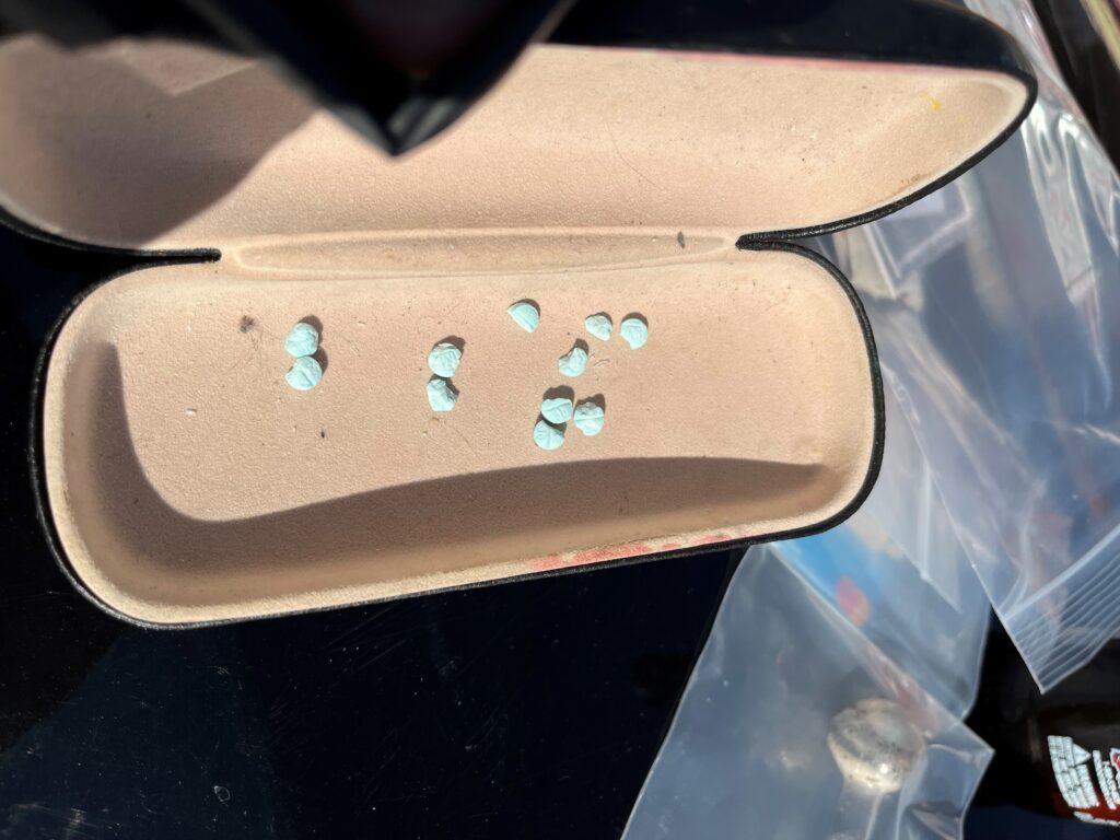 Photo: SLCPD Officers recovered multiple blue M30 pills suspected of containing fentanyl (SLCPD photo, January 16, 2024).